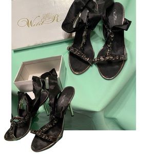 Black satin strap around ankle heals